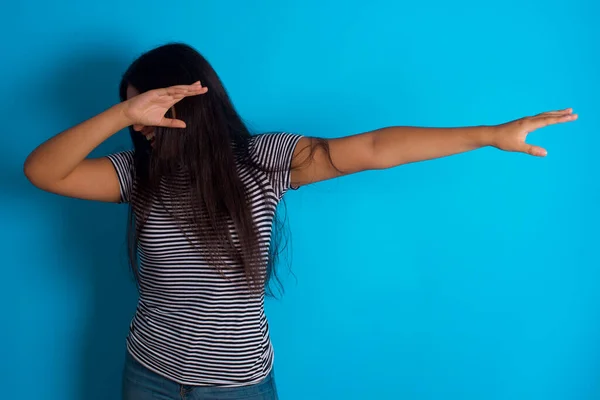 Photo Funky Young Hispanic Girl Wearing Striped Shirt Blue Background — Stock Photo, Image