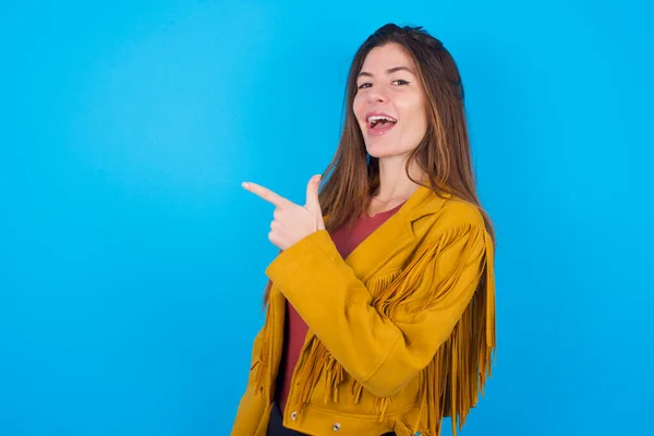 Woman Wearing Jacket Blue Studio Background Pointing Away Smiling You — Stock Photo, Image