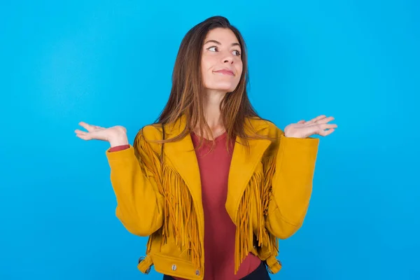 Maybe Yes Doubtful Woman Wearing Jacket Blue Studio Background Shrugs — Stock Photo, Image