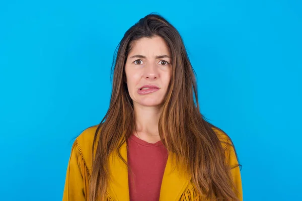 Young Beautiful Woman Wearing Jacket Blue Studio Background Being Nervous — Stock Photo, Image