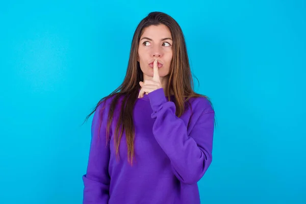 Beautiful Woman Wearing Purple Sweater Blue Studio Background Makes Silence — Stock Photo, Image