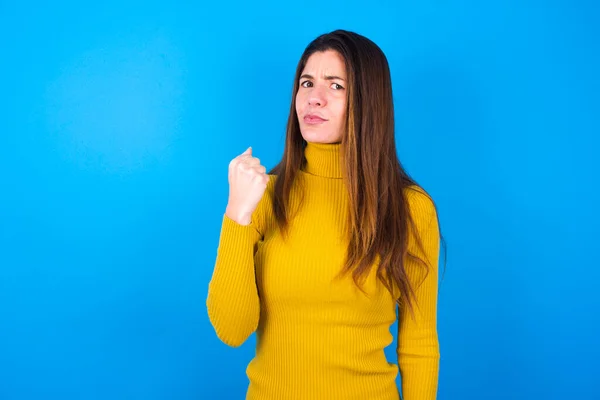 Woman Wearing Turtleneck Sweater Shows Fist Has Annoyed Face Expression — Stock Photo, Image