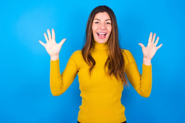 Delighted Positive Woman Opens Mouth Arms Palms Having Great Result — Stock Photo, Image