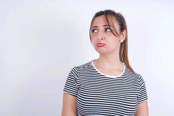 Dissatisfied Young Arab Woman Wearing Striped Shirt White Background Purses — Stock Photo, Image