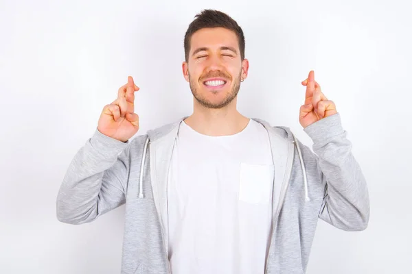 Joyful Young Caucasian Man Wearing Casual Clothes White Background Clenches — Stock Photo, Image