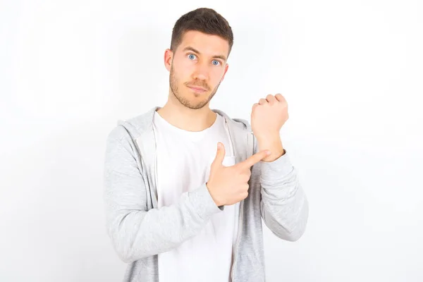Young Caucasian Man Wearing Casual Clothes White Background Hurry Pointing — Stock Photo, Image