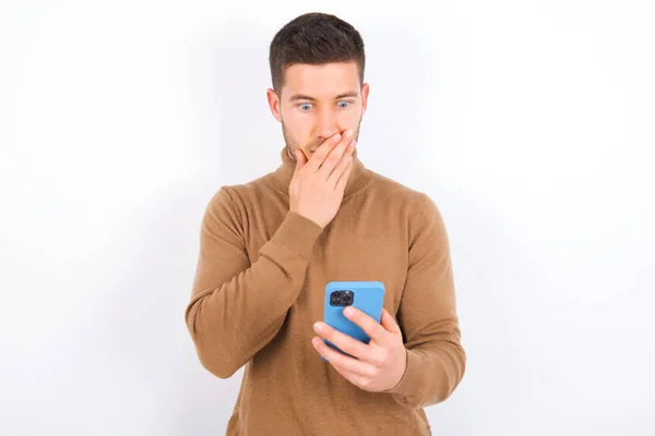 Young Caucasian Man Wearing Turtleneck White Background Being Deeply Surprised — Stock Photo, Image