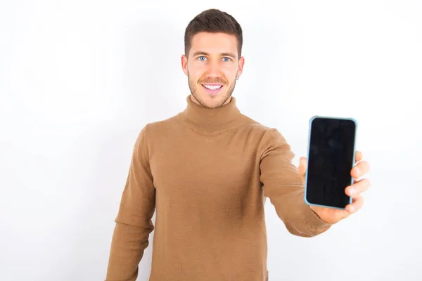 Charming Adorable Young Caucasian Man Wearing Turtleneck White Background Holding — Stock Photo, Image