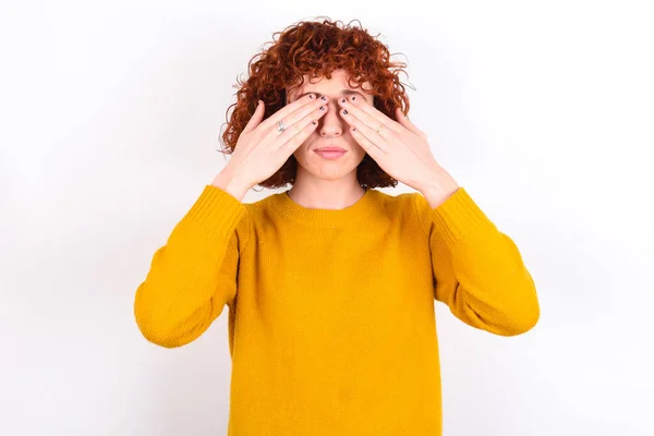 Young Redhead Girl Wearing Yellow Sweater White Background Covering Eyes — Stock Photo, Image