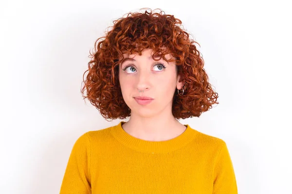 Young Redhead Girl Wearing Yellow Sweater White Background Crosses Eyes — Stock Photo, Image