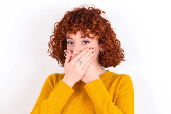 Upset Young Redhead Girl Wearing Yellow Sweater White Background Covering — Stock Photo, Image