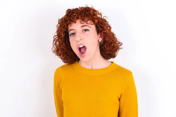 Expressive Facial Expressions Shocked Stupefied Young Redhead Girl Wearing Yellow — Stock Photo, Image