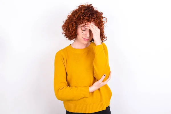 Young Redhead Girl Wearing Yellow Sweater White Background Making Facepalm — Stock Photo, Image
