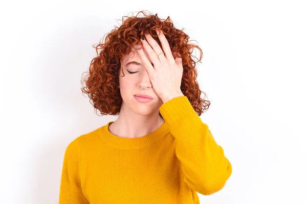 Frustrated Young Redhead Girl Wearing Yellow Sweater White Background Holding — Stock Photo, Image