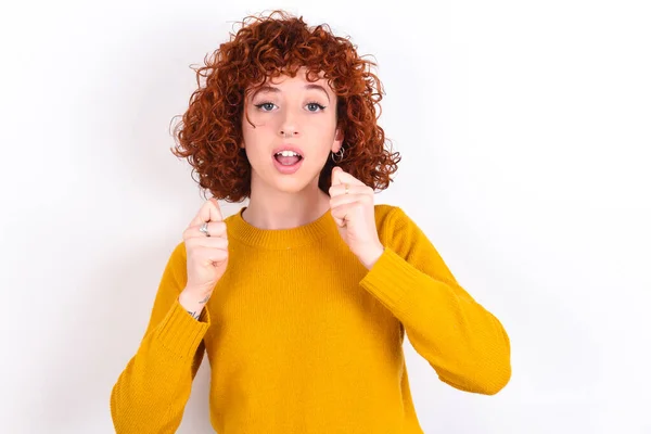 Portrait Desperate Shocked Young Redhead Girl Wearing Yellow Sweater White — Stock Photo, Image
