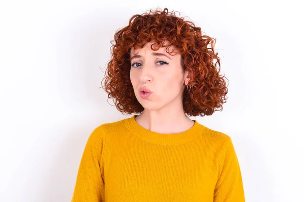 Young Redhead Girl Wearing Yellow Sweater White Background Expressing Disgust — Stock Photo, Image