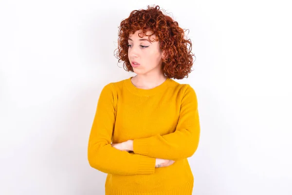Displeased Young Redhead Girl Wearing Yellow Sweater White Background Bad — Stock Photo, Image