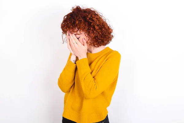 Sad Young Redhead Girl Wearing Yellow Sweater White Background Covering — Stock Photo, Image