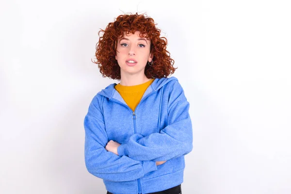 Young Redhead Girl Wearing Blue Jacket White Background Frowning His — Stock Photo, Image