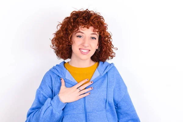 Young Redhead Girl Wearing Blue Jacket White Background Smiles Toothily — Stock Photo, Image