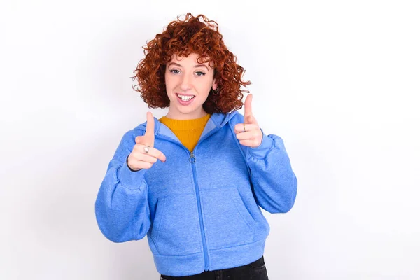 Young Redhead Girl Wearing Blue Jacket White Background Directs Fingers — Stock Photo, Image