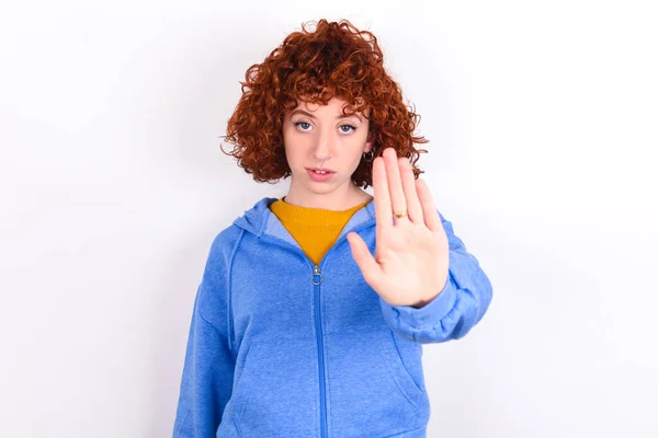 Young Redhead Girl Wearing Blue Jacket White Background Shows Stop — Stock Photo, Image