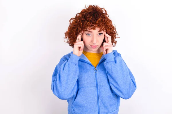 Serious Concentrated Young Redhead Girl Wearing Blue Jacket White Background — Stock Photo, Image