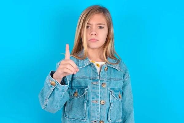 Blonde Caucasian Little Girl Wearing Denim Jacket Frustrated Pointing Front — Stock Photo, Image