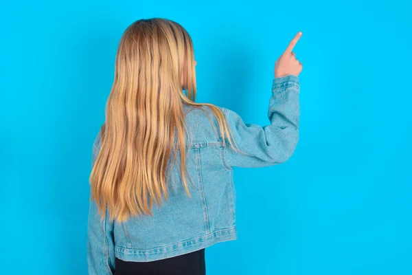 Blonde Caucasian Little Girl Wearing Denim Jacket Pointing Object Copy — Stock Photo, Image