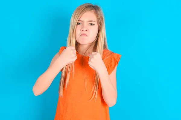 Displeased Annoyed Little Kid Girl Wearing Orange Shirt Blue Background — Stock Photo, Image