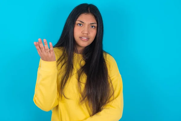 Studio Shot Frustrated Latin Woman Wearing Yellow Sweatshirt Blue Background — Photo