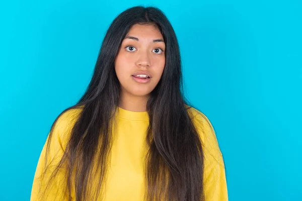 Emotional Attractive Latin Woman Wearing Yellow Sweatshirt Blue Background Opened — Stock Photo, Image