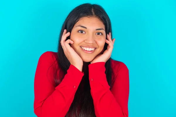Happy Latin Woman Wearing Red Shirt Blue Background Touches Both — Stock Photo, Image