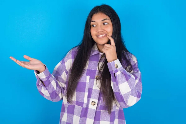 Positive Latin Woman Wearing Plaid Shirt Blue Background Advert Promo — Stock Photo, Image
