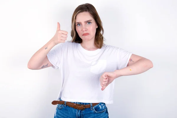 Girl Feeling Unsure Making Good Bad Sign Displeased Unimpressed Young — Stock Photo, Image
