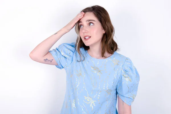 Young Caucasian Woman Wearing Blue Shirt White Background Touching Forehead — Stock Photo, Image