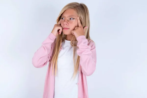 Blonde Little Girl Wearing Pink Jacket Glasses White Background Grimacing — Stock Photo, Image