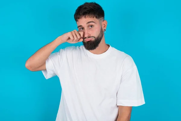 Unhappy Bearded Caucasian Man Wearing White Shirt Blue Background Crying — Stock Photo, Image