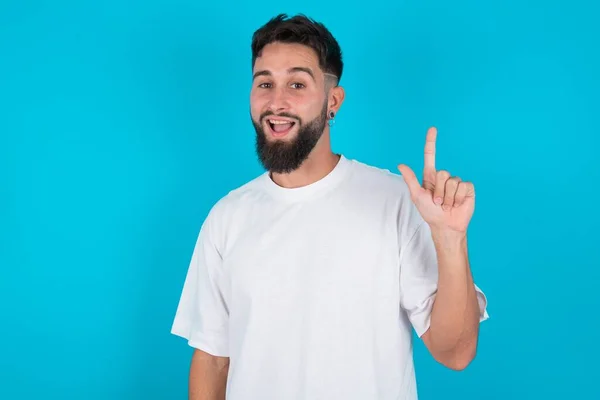 Pleasant Looking Bearded Caucasian Man Wearing White Shirt Blue Background — Stock Photo, Image