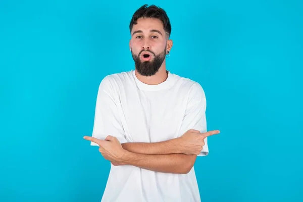 Confused Bearded Caucasian Man Wearing White Shirt Blue Background Chooses — Stock Photo, Image