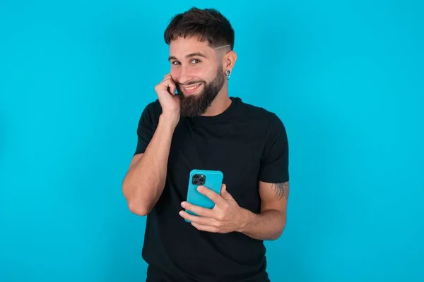 Joyous Hispanic Bearded Man Wearing Black Shirt Standing Blue Background — Stock Photo, Image