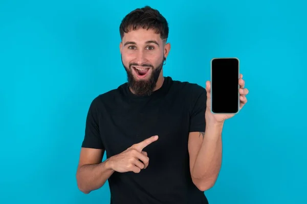 Attractive Cheerful Hispanic Bearded Man Wearing Black Shirt Standing Blue — Stock Photo, Image