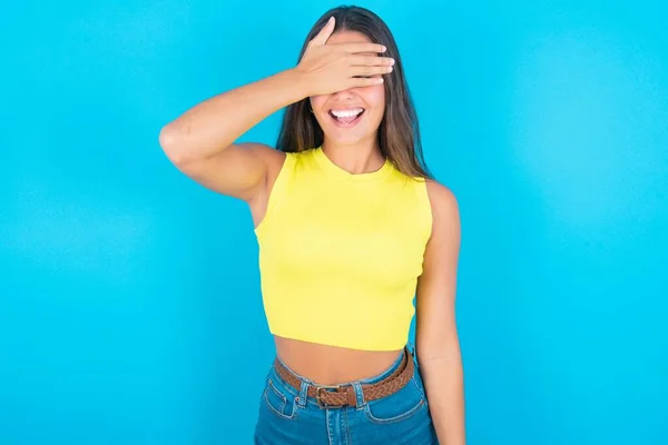 Happy Beautiful Brunette Woman Wearing Yellow Tank Top Blue Background — Stock Photo, Image