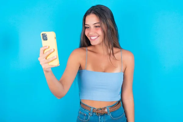 Cheerful Caucasian Brunette Woman Wearing Blue Tank Top Makes Selfie — Stock Photo, Image