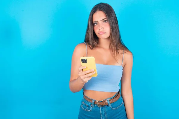 Upset Dissatisfied Young Brunette Woman Wearing Blue Tank Top Blue — Stock Photo, Image