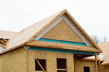 plywood walls and roof of the new house frame plank lumber