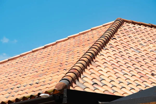 the roof covered with tiles style work roofing contractor
