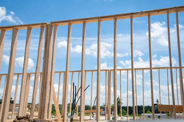Framing structure wood frame of wooden home house construction and real estate concept background blue sky new residental framework