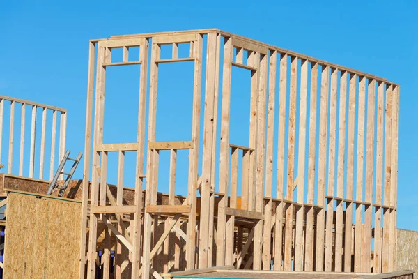 Residential american home in under construction beams house wooden frame house frame sky