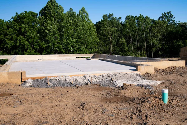 view of construction site and house foundation in preparation process cement material floor